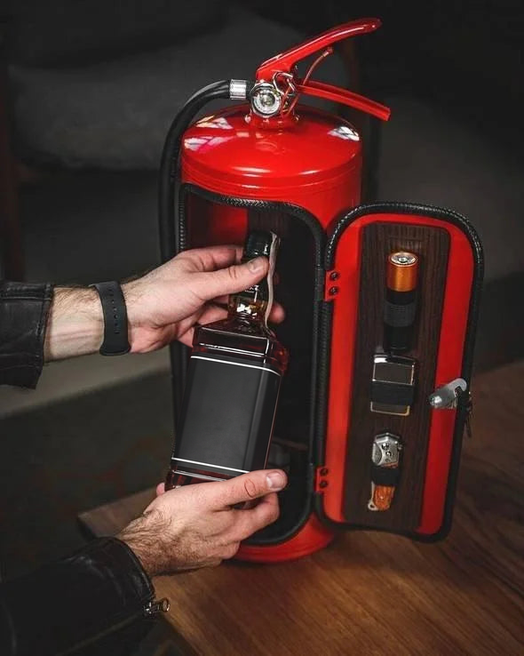Fire extinguisher mini bar opened with a bottle inside