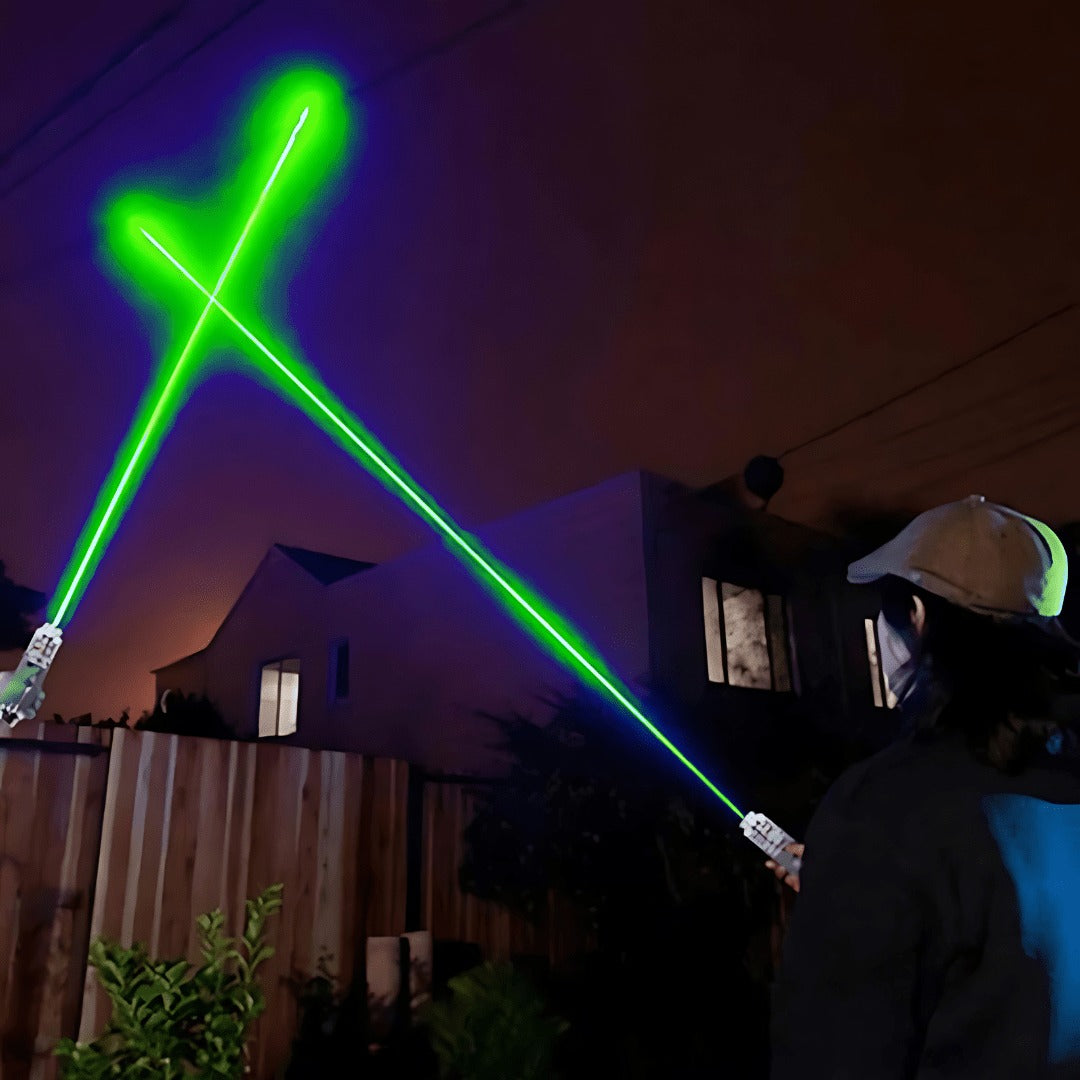 Green laser pointer beams in the night sky