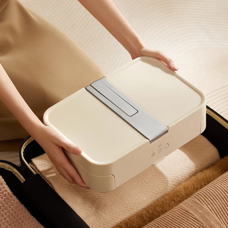 Portable electric clothes dryer packed in a suitcase for travel